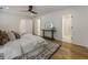 Bright main bedroom with neutral tones, hardwood floors, and stylish accents at 1860 Mountain Shadow, Stone Mountain, GA 30087