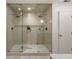 Large walk-in shower with dual shower heads, glass doors, and tile surround at 1860 Mountain Shadow, Stone Mountain, GA 30087