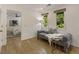 A bright sitting area off of the bedroom features wood floors and a gray chaise lounge at 1860 Mountain Shadow, Stone Mountain, GA 30087