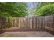 Private backyard with wood fence and mulched area for easy landscaping at 2117 Bucktrout Pl, Dunwoody, GA 30338