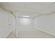 Basement area with carpet, white walls, and a fluorescent light at 2117 Bucktrout Pl, Dunwoody, GA 30338