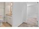 Bathroom with white vanity, granite countertops, and a toilet at 2117 Bucktrout Pl, Dunwoody, GA 30338