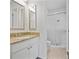 Bathroom with a vanity and granite countertops, a white toilet, and a shower with sliding glass doors at 2117 Bucktrout Pl, Dunwoody, GA 30338
