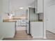 Kitchen with white cabinetry, stainless steel refrigerator, and granite countertops at 2117 Bucktrout Pl, Dunwoody, GA 30338
