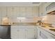 Well-maintained kitchen featuring white cabinets, granite countertops, and stainless steel appliances at 2117 Bucktrout Pl, Dunwoody, GA 30338