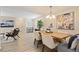 Charming living area flows into dining space, showcasing bright interiors and hardwood floors at 2117 Bucktrout Pl, Dunwoody, GA 30338