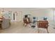 Open-concept living and dining area with hardwood floors and neutral decor; great for entertaining at 2117 Bucktrout Pl, Dunwoody, GA 30338