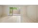 Spacious living room with tile flooring and sliding glass doors to the outside at 2117 Bucktrout Pl, Dunwoody, GA 30338