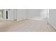 Bright living room with wood floors, white trim, and a view of a window at 2117 Bucktrout Pl, Dunwoody, GA 30338