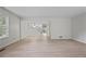 Bright living room with wood floors, neutral walls, and a view of the staircase at 2117 Bucktrout Pl, Dunwoody, GA 30338