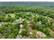 An aerial view showcases the home's neighborhood with lush greenery and mature trees at 4079 Essex Dr, Villa Rica, GA 30180