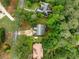 An aerial view of a well-maintained home with a long driveway nestled among lush greenery at 4079 Essex Dr, Villa Rica, GA 30180