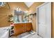 Well-lit bathroom features a bathtub, vanity, and a large mirror at 4079 Essex Dr, Villa Rica, GA 30180