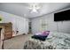 Bright bedroom with a queen bed, natural light from the window, and modern gray walls at 4079 Essex Dr, Villa Rica, GA 30180