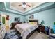 Calm main bedroom boasts trey ceilings, a cozy rug, and lots of decorative furniture at 4079 Essex Dr, Villa Rica, GA 30180