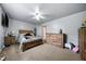 Neutral bedroom featuring a queen bed, wooden furniture, and plenty of floor space at 4079 Essex Dr, Villa Rica, GA 30180