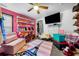 Charming bedroom featuring custom shoe storage shelves and playful Paris themed decor at 4079 Essex Dr, Villa Rica, GA 30180