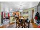 Open concept dining area with a stylish chandelier and hardwood floors at 4079 Essex Dr, Villa Rica, GA 30180