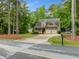Charming two-story home featuring a covered porch, attached two-car garage, and a well-manicured front yard at 4079 Essex Dr, Villa Rica, GA 30180