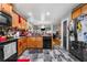 Kitchen featuring granite counters, stainless steel appliances, and wood cabinets at 4079 Essex Dr, Villa Rica, GA 30180
