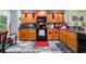 Kitchen with wooden cabinets, granite countertops and modern appliances at 4079 Essex Dr, Villa Rica, GA 30180