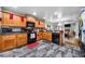 A kitchen featuring granite counters, wood cabinets, and modern appliances at 4079 Essex Dr, Villa Rica, GA 30180