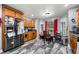 Kitchen with stainless steel appliances, wooden cabinets and marble style tile floors at 4079 Essex Dr, Villa Rica, GA 30180