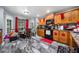 Spacious kitchen featuring granite counters, wood cabinets, and modern appliances at 4079 Essex Dr, Villa Rica, GA 30180