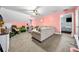 Open concept living space with plush sofa, neutral decor, and a glimpse of a bedroom beyond at 4079 Essex Dr, Villa Rica, GA 30180