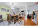 Open concept living room with a stylish dining area, hardwood floors and chandelier at 4079 Essex Dr, Villa Rica, GA 30180