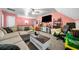 Cozy living room features an oversized sectional and a large television for entertainment at 4079 Essex Dr, Villa Rica, GA 30180