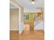 Foyer featuring hardwood floors and a staircase with white trim at 1558 Park Knoll Trl, Lawrenceville, GA 30043
