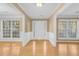 Bright foyer with hardwood floors and white trim details at 1558 Park Knoll Trl, Lawrenceville, GA 30043