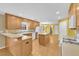 Bright kitchen with an island, hardwood floors, and white appliances at 1558 Park Knoll Trl, Lawrenceville, GA 30043