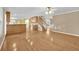 Open-concept living area with hardwood floors, a kitchen, and a staircase at 1558 Park Knoll Trl, Lawrenceville, GA 30043