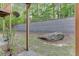 View of the backyard featuring a retaining wall and large rock at 3194 Mill Springs Cir, Buford, GA 30519
