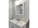 Modern bathroom features a white vanity, brushed nickel faucet and stylish mirror for a clean, contemporary feel at 3194 Mill Springs Cir, Buford, GA 30519