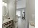 View from the bathroom with a vanity leading into the bedroom with a window at 3194 Mill Springs Cir, Buford, GA 30519