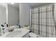 Bathroom featuring a vanity with a mirror and a shower/tub combo with a decorative shower curtain at 3194 Mill Springs Cir, Buford, GA 30519