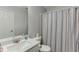 Bathroom features a vanity with mirror, sink and a shower with a stylish curtain providing a comfortable and clean space at 3194 Mill Springs Cir, Buford, GA 30519