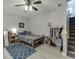 Brightly-lit bedroom featuring a ceiling fan, a gray rug, and natural light at 3194 Mill Springs Cir, Buford, GA 30519