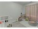 Bright Bedroom with neutral decor, play area, and crib, perfect for a growing Gathering at 3194 Mill Springs Cir, Buford, GA 30519