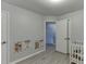 Bright Bedroom with educational wall decor, crib, and playful details, ideal for a learning and comfort at 3194 Mill Springs Cir, Buford, GA 30519