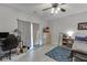 Bedroom with a ceiling fan, natural light, and an adjacent closet at 3194 Mill Springs Cir, Buford, GA 30519