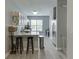 The kitchen features stainless steel appliances, granite countertops and modern white cabinetry at 3194 Mill Springs Cir, Buford, GA 30519