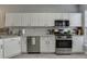 Modern kitchen with white cabinets, stainless steel appliances and granite countertops, perfect for cooking and entertaining at 3194 Mill Springs Cir, Buford, GA 30519