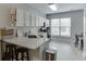 The kitchen features stainless steel appliances, granite countertops and modern white cabinetry at 3194 Mill Springs Cir, Buford, GA 30519