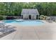 Community pool with lounge chairs and covered patio area, perfect for relaxation at 3194 Mill Springs Cir, Buford, GA 30519