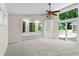 Expansive bedroom featuring large windows, a built-in bench and slider door leading to deck, perfect for relaxation at 4700 Township Walk, Marietta, GA 30066