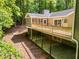 Exterior rear view of home showing a large deck and screened porch; great for outdoor entertaining at 4700 Township Walk, Marietta, GA 30066